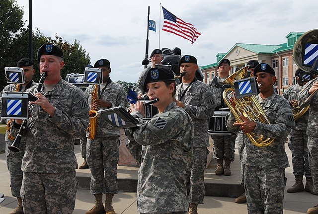 Members of the 3rd ID Band playing musical instruments