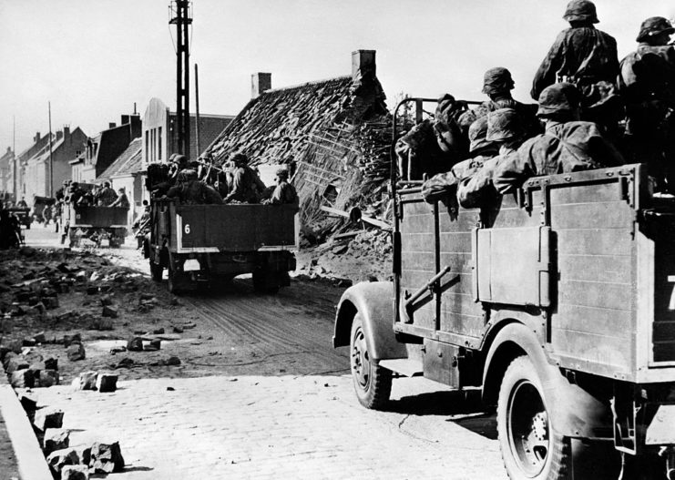 Waffen-SS soldiers riding in a truck during the Battle of France