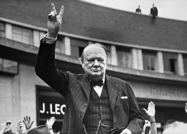 Winston Churchill holding up the "V for victory" hand symbol