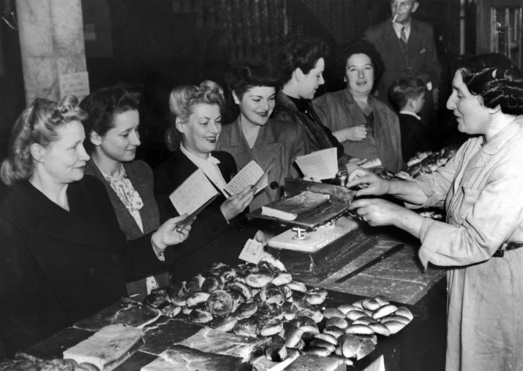 British women with their rationing notebooks 