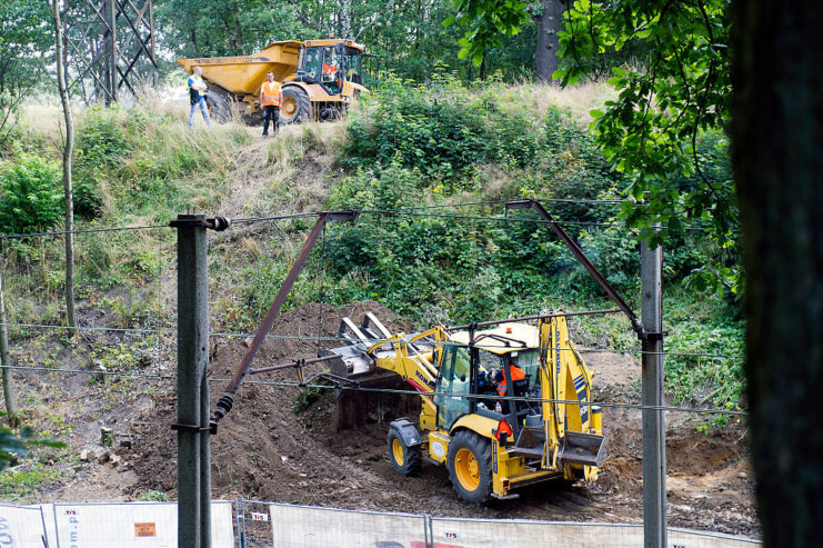 Two bulldozers digging in the forest near the Polish town of Walbrzych