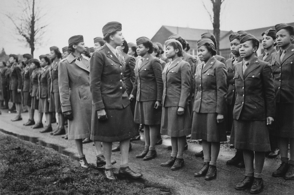 Charity Adams walking in front of a line of 6888th Central Postal Directory Battalion members