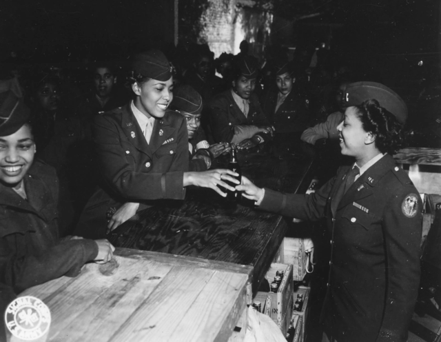 Women of the 6888th Central Postal Directory Battalion sitting at a bar