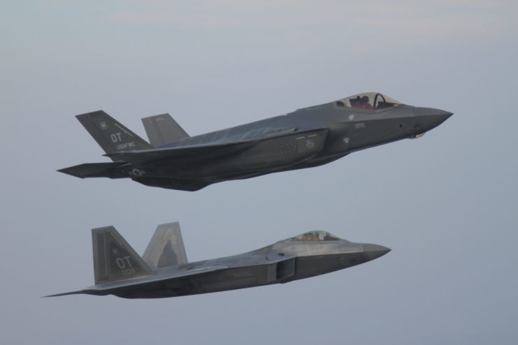 An F-35A Lightning II flies with an F-22 Raptor to test interoperability between the two aircraft platforms.