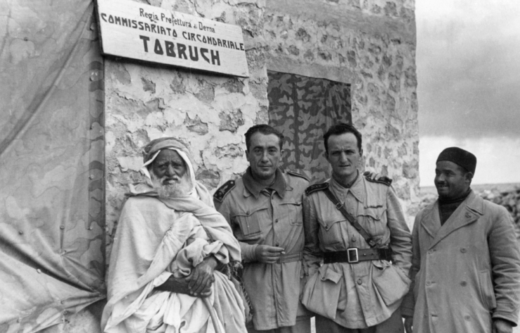 Two officers of the Prison Commissioner of the Italian army with two Libyan civilians at Tobruk, June 1942