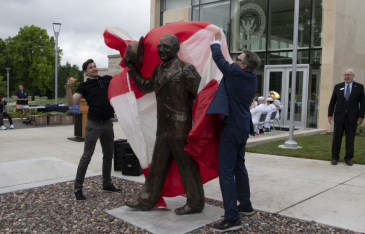 Harry S. Truman’s great-grandson Wesley Daniel, left, and grandson Clifton Truman Daniel unveil the statue gifted for the reopening of the Harry S. Truman Presidential Library and Museum in Independence, Missouri July 1, 2021.