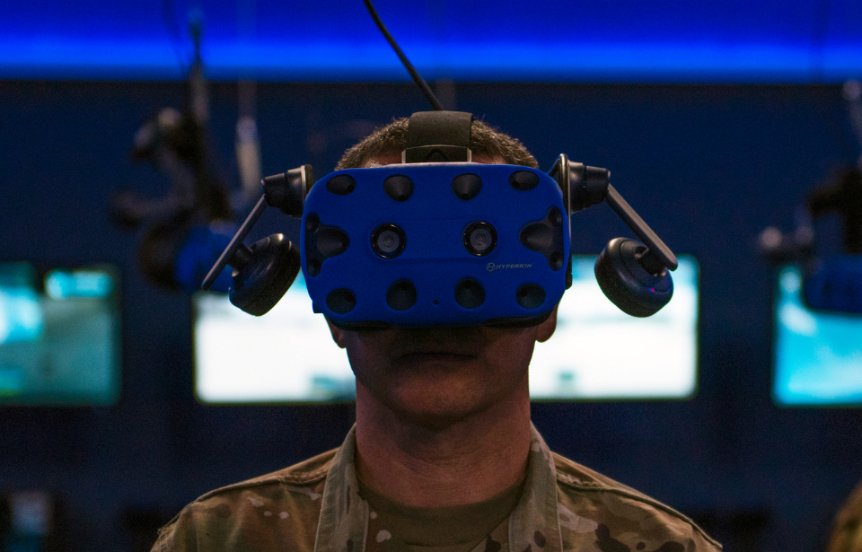 Chief Master Sgt. Brian Kruzelnick uses virtual reality goggles during a capabilities briefing at Dyess Air Force Base, Texas, July 8, 2021. (Photo Credit: U.S. Air Force / Senior Airman Colin Hollowell)