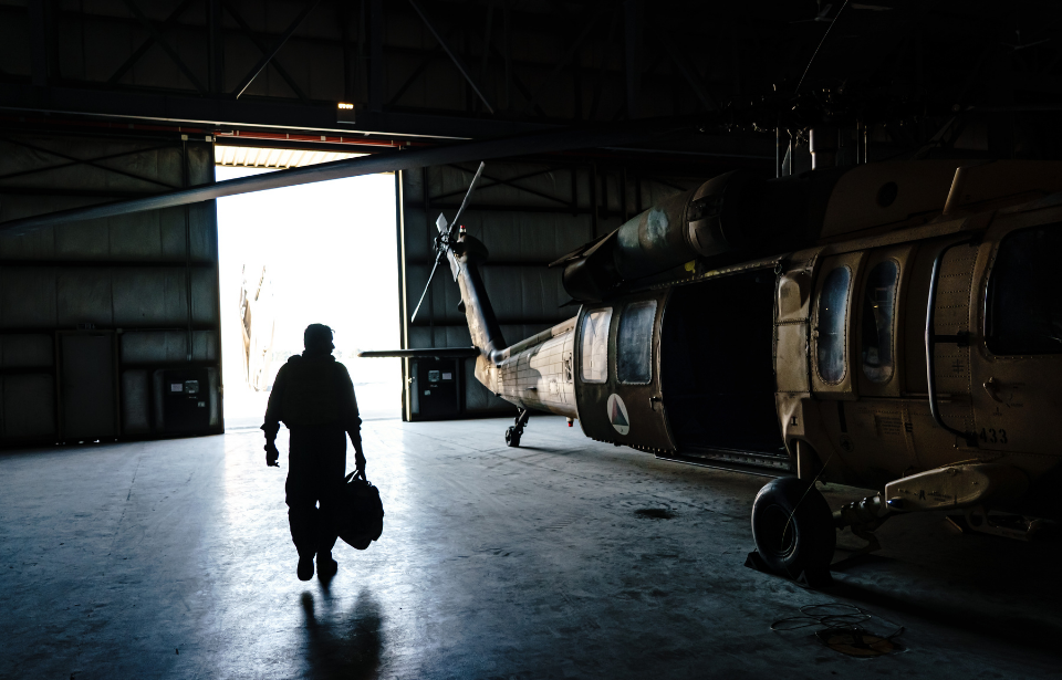 Col. Salim Razmindah walks towards his aircraft to begin his mission from Kabul Airbase, in Kabul, Afghanistan, Sunday, May 9, 2021. The Afghan Air Force, which the U.S. and its partners has nurtured to the tune of $8.5 billion since 2010, would now be the government's spearhead in its fight against the enemy.