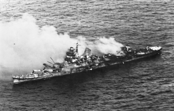 A Japanese Mogani class cruiser burns after being bombed in the Battle of Midway. June 1942.