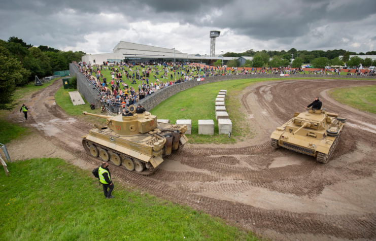 crowds watch tanks go by at the tank museum's tiger day