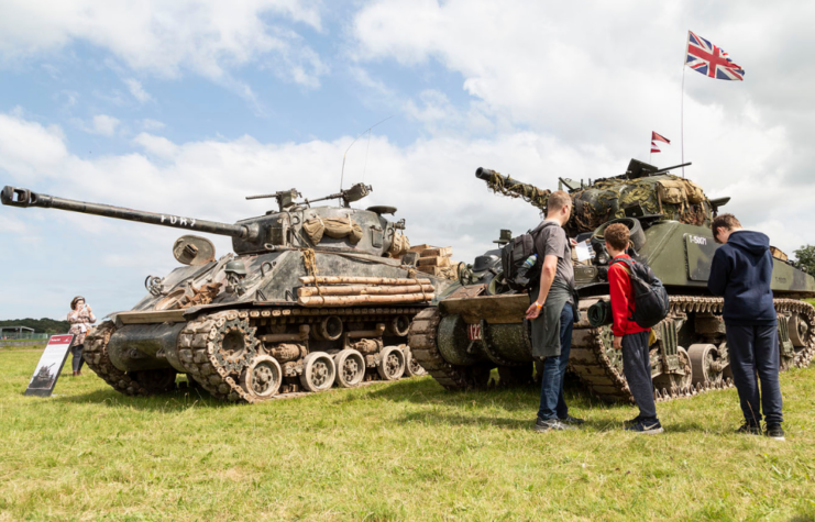 Children viewing tanks