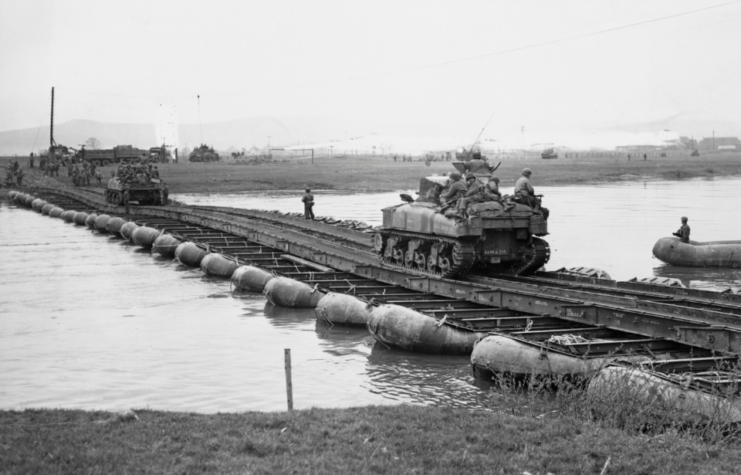 M4 Sherman tanks of the 2nd Armoured Division, United States Ninth Army cross over the Weser River on a pontoon bridge 