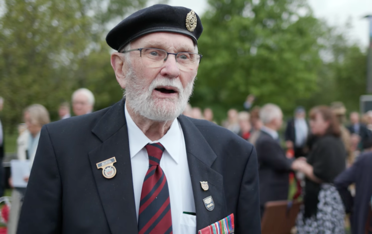 George Batts in a suit, with his medals pinned to his chest