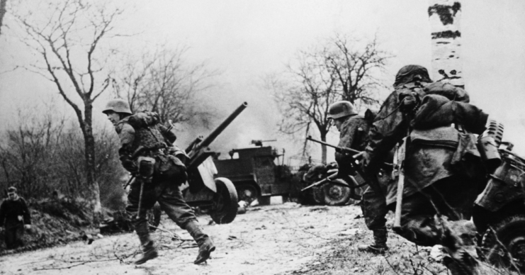 German soldiers advance in the Belgium-Luxembourg sector during the Battle of the Bulge. (Photo Credit: Bettmann/Getty Images)