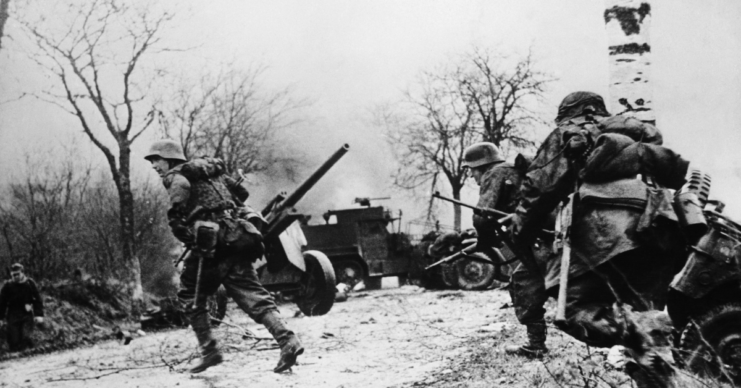 German soldiers running across a road