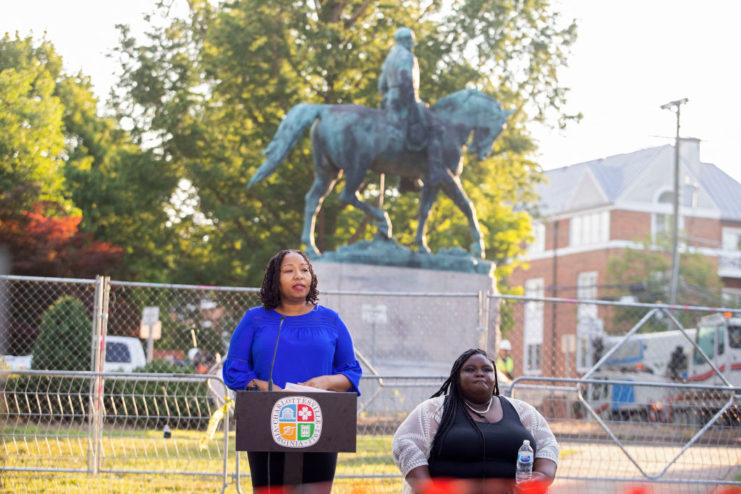 Nikuyah Walker and Zyahna Bryant speaking in front of the Robert E. Lee statue