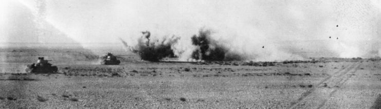 An Axis armoured division is under heavy fire from British artillery. 