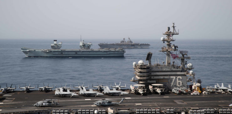 USS Ronald Reagan with the HMS Queen Elizabeth and USS Iwo Jima in the background