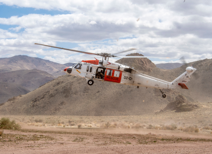 MH-60S Knighthawk helicopter completing simulated search and rescue training. (Photo Credit: U.S. Navy/ Mass Communication Specialist 2nd Class Ryan M. Breeden)