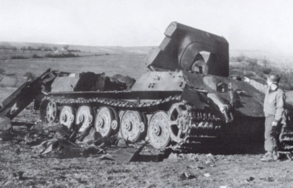 Soldier pointing at a destroyed Jagdtiger