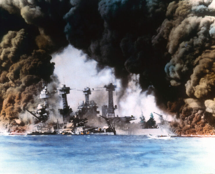 USS West Virginia (BB-48) and Tennessee (BB-43) shrouded in smoke at Pearl Harbor