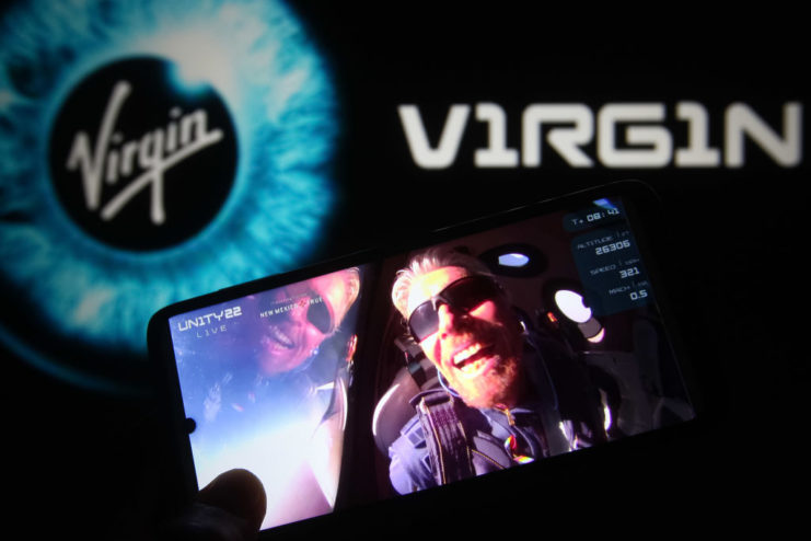 Video of Richard Branson in space being played on a cellphone