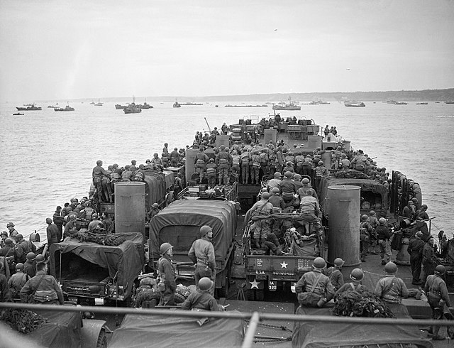 Several members of the Royal Navy on a boat in the ocean