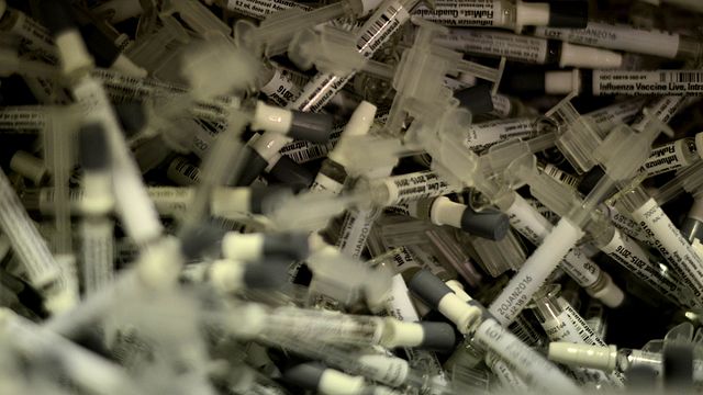 Pile of flu vaccine needles