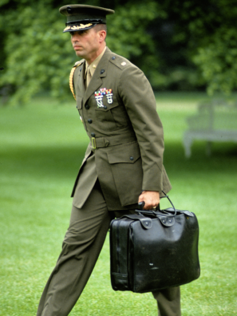 Washington, DC. 1992 US Marine Corps Major serving as a Military Aid at the White House carries the "Nuclear Football". 