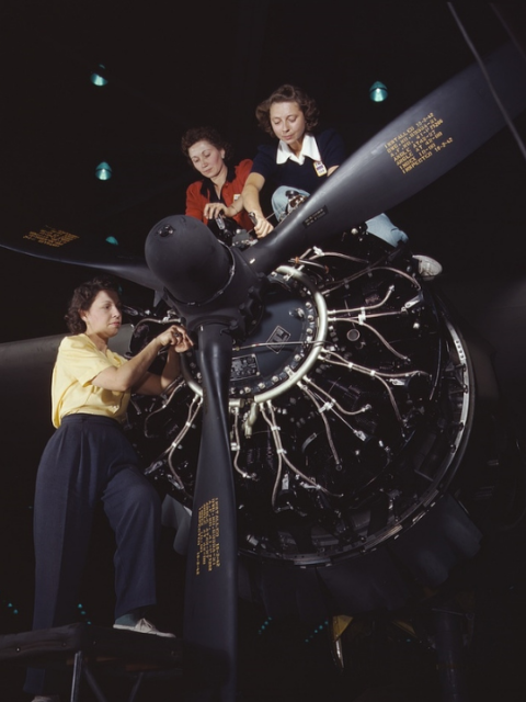 Women working on the Wright R-2600 Cyclone 14 engine of a Douglas A-20 Havoc twin-engine bomber at Douglas Aircraft Company's plant in Long Beach, California.