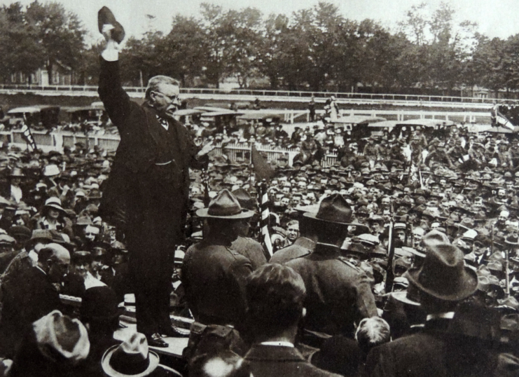 Theodore "Teddy" Roosevelt standing before a large crowd