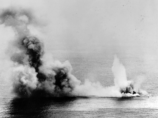 Yahagi shrouded in smoke in the middle of the ocean