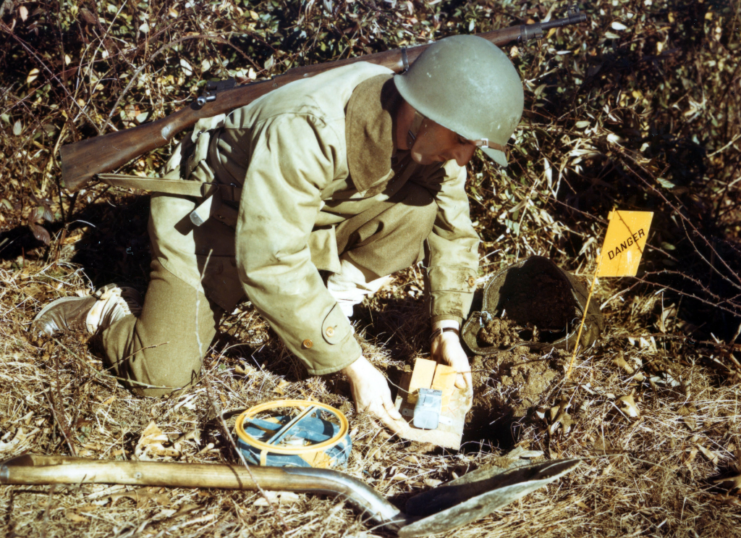 army engineer planting a landmine, 1945