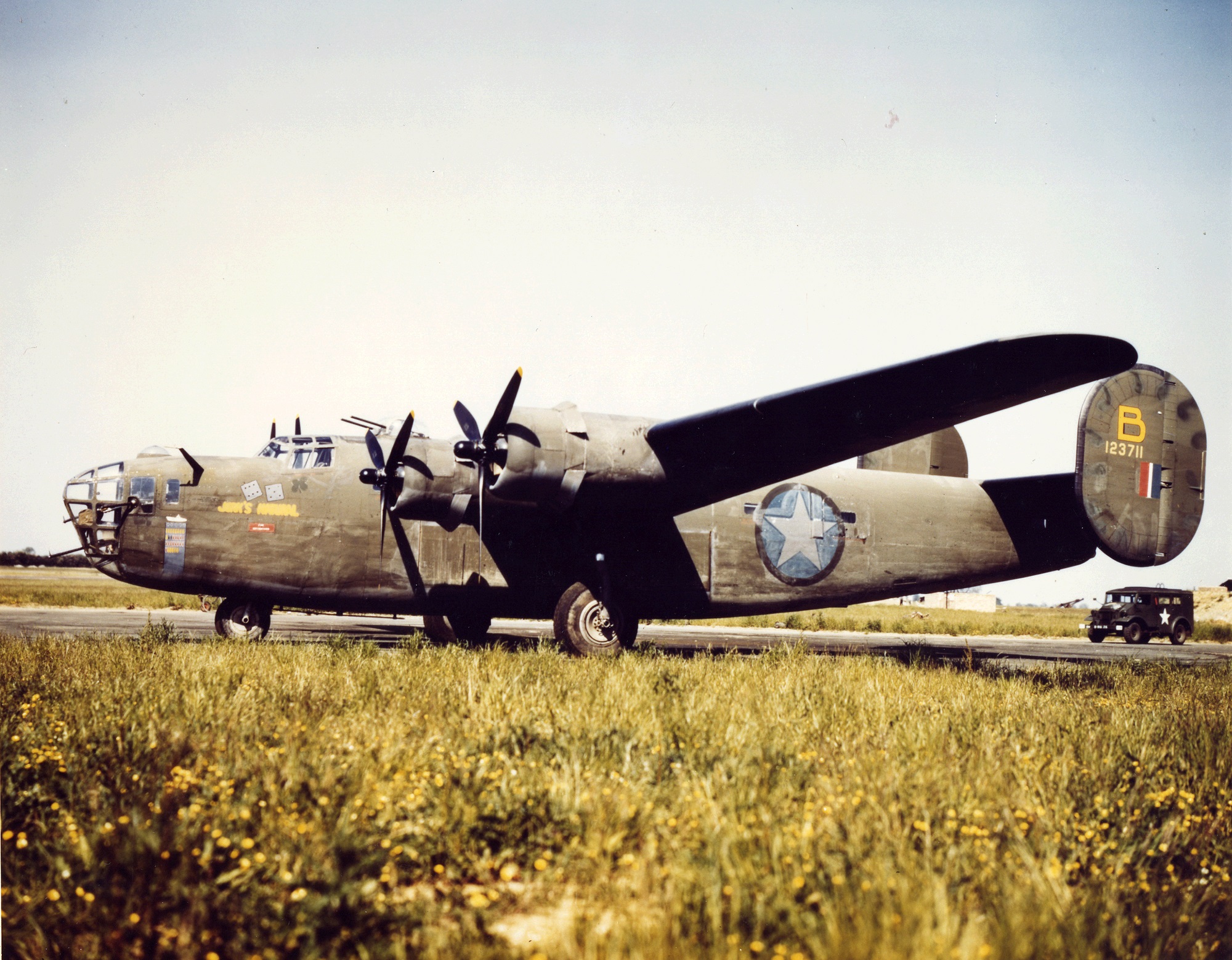 View of a Consolidated B-24 Liberator heavy bomber (from the 8th Air Force), nicknamed 'Jerk's Natural,' parked on the tarmac, England, 1940s. (Photo by PhotoQuest/Getty Images)