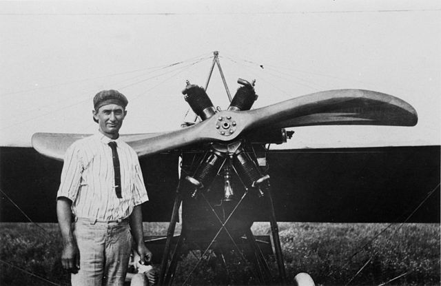 Clyde Cessna standing next to an airplane