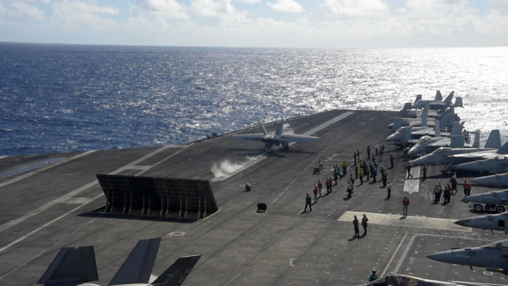 MC3 Erin Zorich taxiing down the runway of the USS Carl Vinson