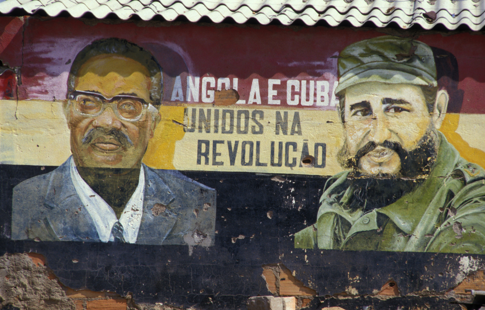Mural of Castro and Angola's Agostinho Neto in Angola, 1987. (Photo Credit: Laurent MAOUS/Gamma-Rapho via Getty Images)