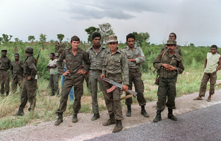 A group of Cuban soldiers helping Angolan regular army and Soviet-backed Marxist MPLA regime in Luanda, patrol 29 February 1988 near Cuito Cuanavale, southern Angola, where they are fighting against anti-Marxist and Western-backed UNITA nationalist movement.