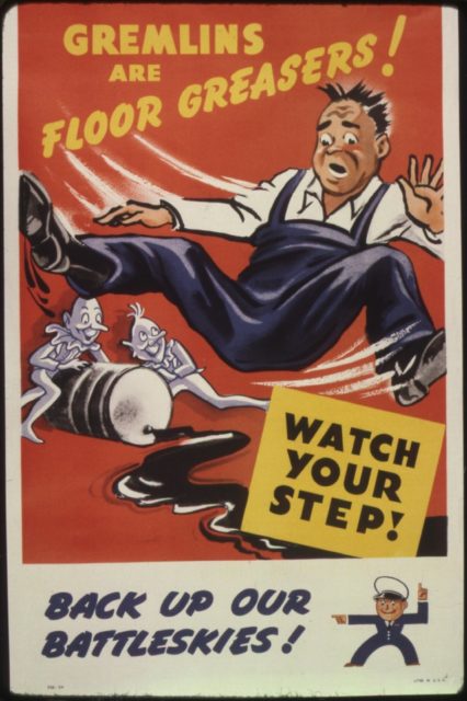 Man slipping on grease pouring from a barrel tipped over by gremlins