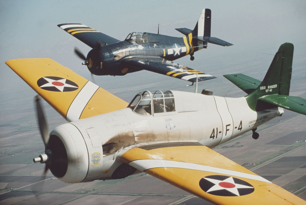 Two aircraft of the Confederate Air Force (later the Commemorative Air Force or CAF), a collection of historical aircraft in Texas, circa 1965. In the foreground is a 1941 Grumman F4F Wildcat VF-41 of the US Navy, from the aircraft carrier 'USS Ranger'. (Photo by Archive Photos/Getty Images)