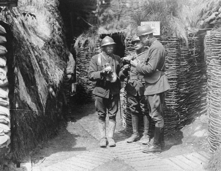 U.S. Army African American Soldiers of the Harlem Hellfighters learn from French mentors in trench warfare in an undated photo during WWI. 