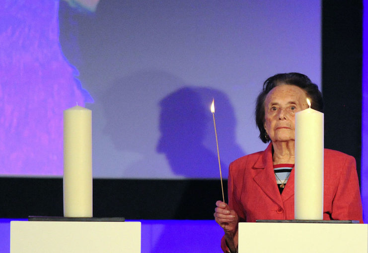 Lily Ebert lighting a candle