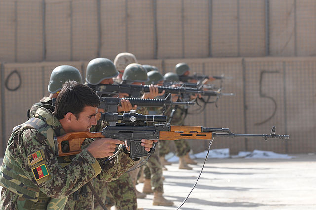 Afghan National Army members and U.S. Marines holding rifles