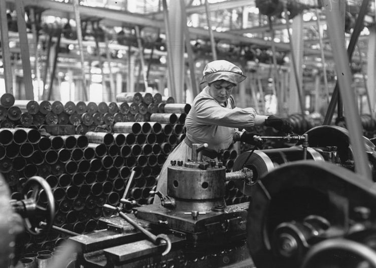 Woman working at a machine in a factory