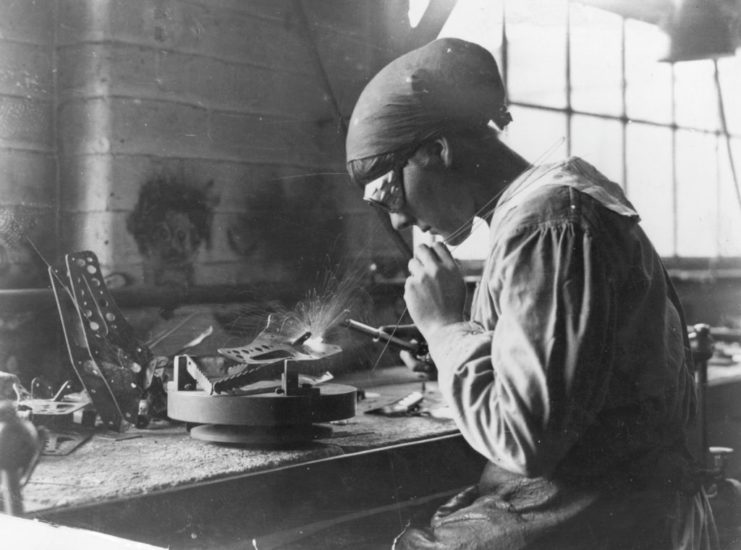 Woman working with a machine at a desk