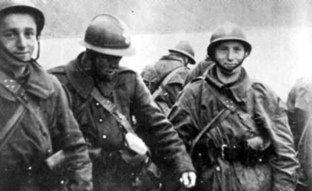 Polish soldiers standing together in military uniform