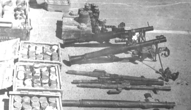 Weapons cache laid out on the ground