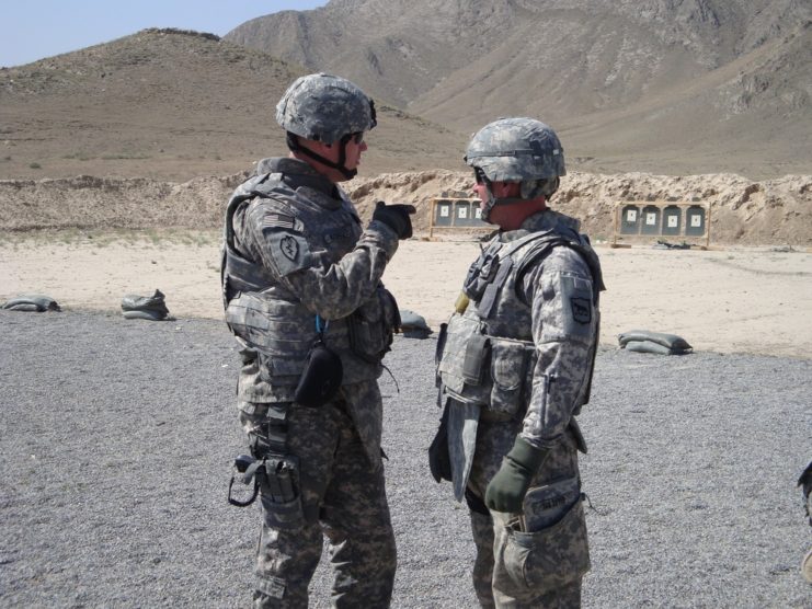 U.S. soldier pointing to another soldier