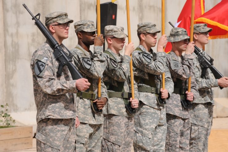 Six U.S. soldiers standing at attention