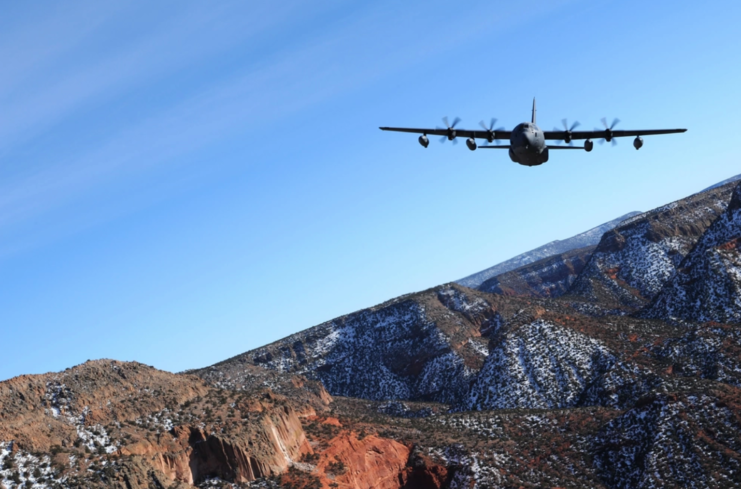 52nd Special Operations Squadron MC-130J Combat Shadow II flying above mountains